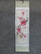 A Japanese mounted scroll, ink on paper, song birds among the cherry blossom with artist's seal.