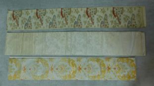 Three Japanese embroidered silk Obis with various floral designs. W.406cm (largest)