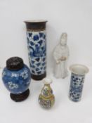 A collection of five Chinese porcelain items. Including a blue and white cylindrical phoenix vase, a