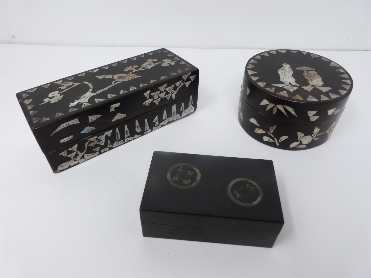 Three Chinese lacquered boxes. Two rectangular in shape the other circular, one rectangular and
