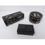 Three Chinese lacquered boxes. Two rectangular in shape the other circular, one rectangular and