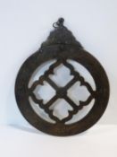 An Islamic brass engraved decorative astrolabe. Decorated with calligraphy. L 37cm