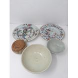 A collection of Qing dynasty Chinese porcelain. Including a ceramic unglazed coin box, a Famille