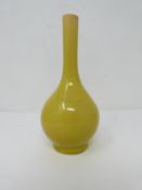 A 18th century Chinese small yellow crackle glaze bottle vase. H15.5cm