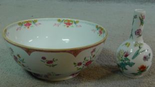 A Chinese 18th century porcelain Famille Rose bowl with floral spray decoration along with a 20th