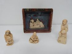 Four Japanese and Chinese carved ivory netsuke, one in a glass fronted silk lined case and one