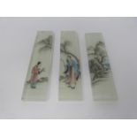 Three Qing dynasty Chinese reverse painted, opaque white glass backed bricks/scroll weights.
