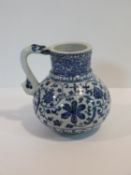 A Chinese blue and white ?Islamic market? pattern porcelain jug/tankard with dragon form handle