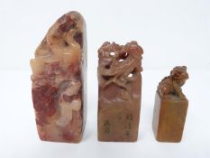 Three Qing dynasty soapstone chops. One with a Pho dog, one with an old man in front of a rock and
