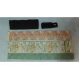 Five Japanese embroidered silk and fabric Obis with various floral designs, two decorated with