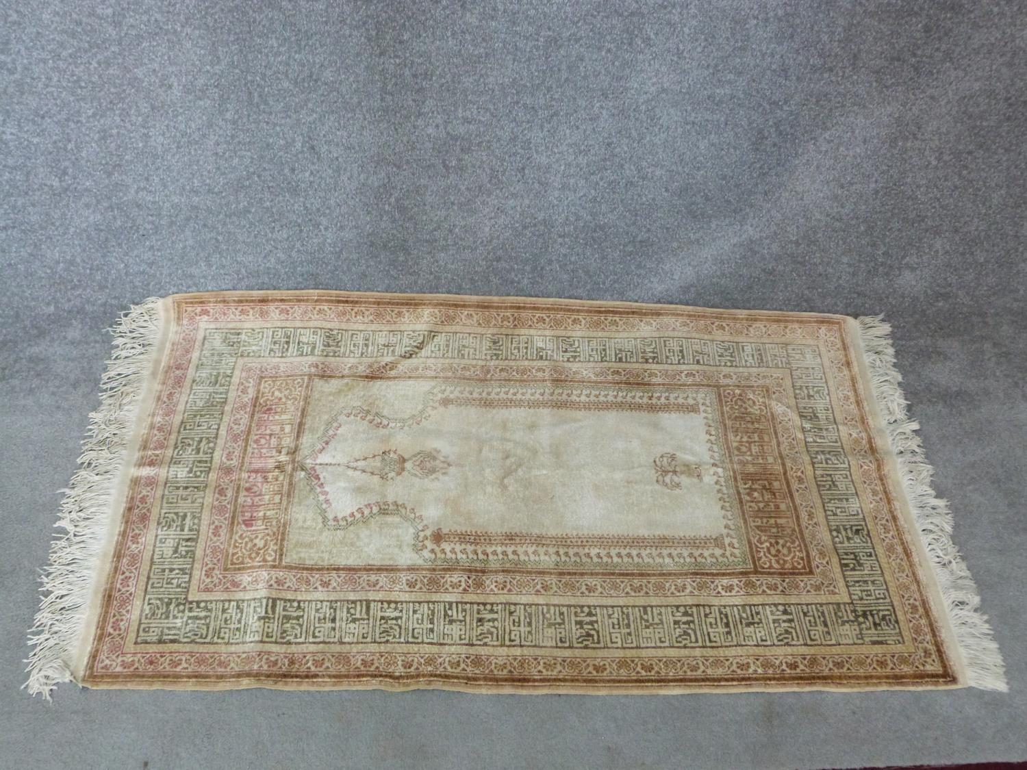 A woven Turkish prayer rug with Mehrab and lamp, mosque and calligraphy border design. 154x88 - Image 2 of 9