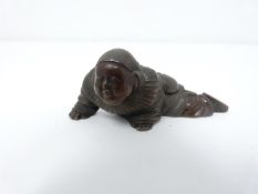 A Meji period Japanese bronze netsuke of a young crawling boy. Intricately detailed. L6.3cm