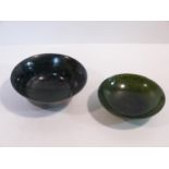 Two 20th century Chinese carved stone bowls. One green stone footed bowl with flared rim. The