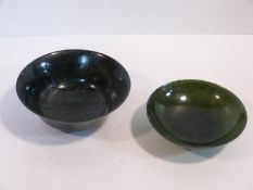 Two 20th century Chinese carved stone bowls. One green stone footed bowl with flared rim. The