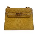 A yellow Hermes Kelly in Lizard with gold hardware, including strap. W.20cm x H.14cm x D.9cm,
