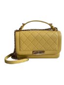 A Chanel Label Click Bag in Yellow Calfskin with Gold Hardware is from Chanel?s 2017 Cruise