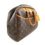 A Louis Vuitton Deauville Cosmetic Bag Monogram Canvas, featuring the LV monogram coated canvas