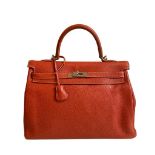 A sanguine Hermes Kelly in clemence leather with palladium hardware, includes Dustbag, Raincover,