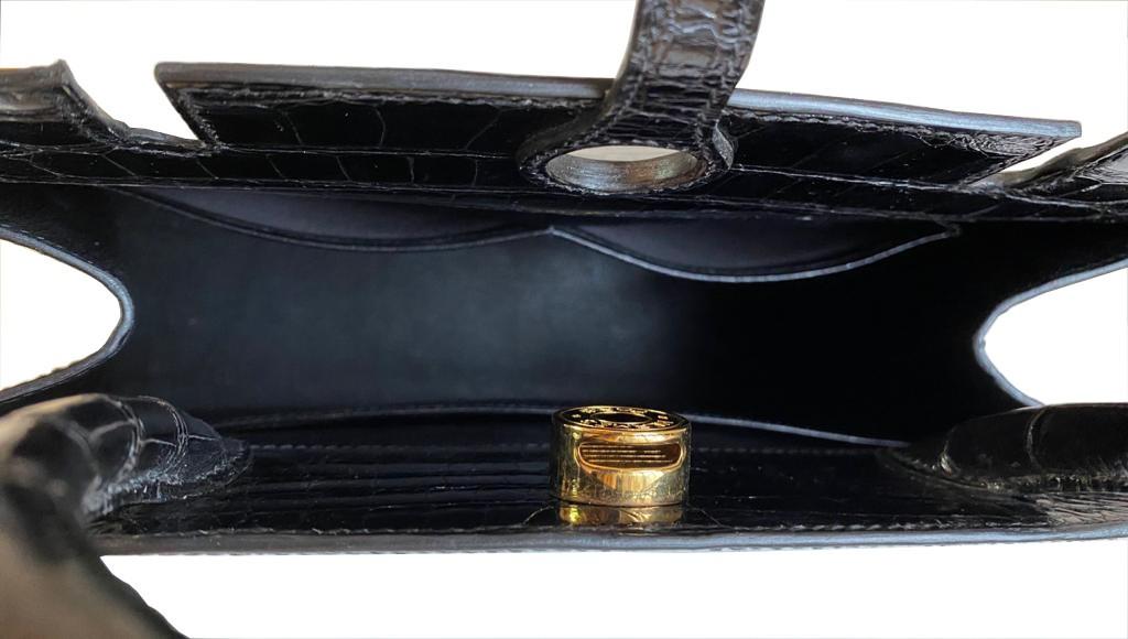 A Hermes Dalvy in black shiny crocodile with gold hardware and orange dustbag. W.30 x H.23 x D.10cm, - Image 5 of 9