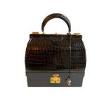 A Hermes Mallet bag in black shiny crocodile with gold hardware, includes Brown Dustbag, Keys &