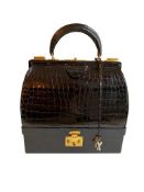 A Hermes Mallet bag in black shiny crocodile with gold hardware, includes Brown Dustbag, Keys &