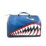 A Louis Vuitton Speedy 30 in Toledo Blue Epi Leather has rolled handles, a top zip closure and an