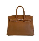 A gold Hermes Birkin in fjord leather with palladium hardware, with key, lock and spa receipt, W.