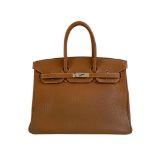A gold Hermes Birkin in fjord leather with palladium hardware, with key, lock and spa receipt, W.