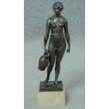 A bronze of a standing Classical female figure with water pitcher on square marble base. H.33cm