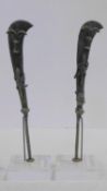 A pair of miniature Ashanti bronze swords with sculpted fish and scorpion motifs. Mounted on