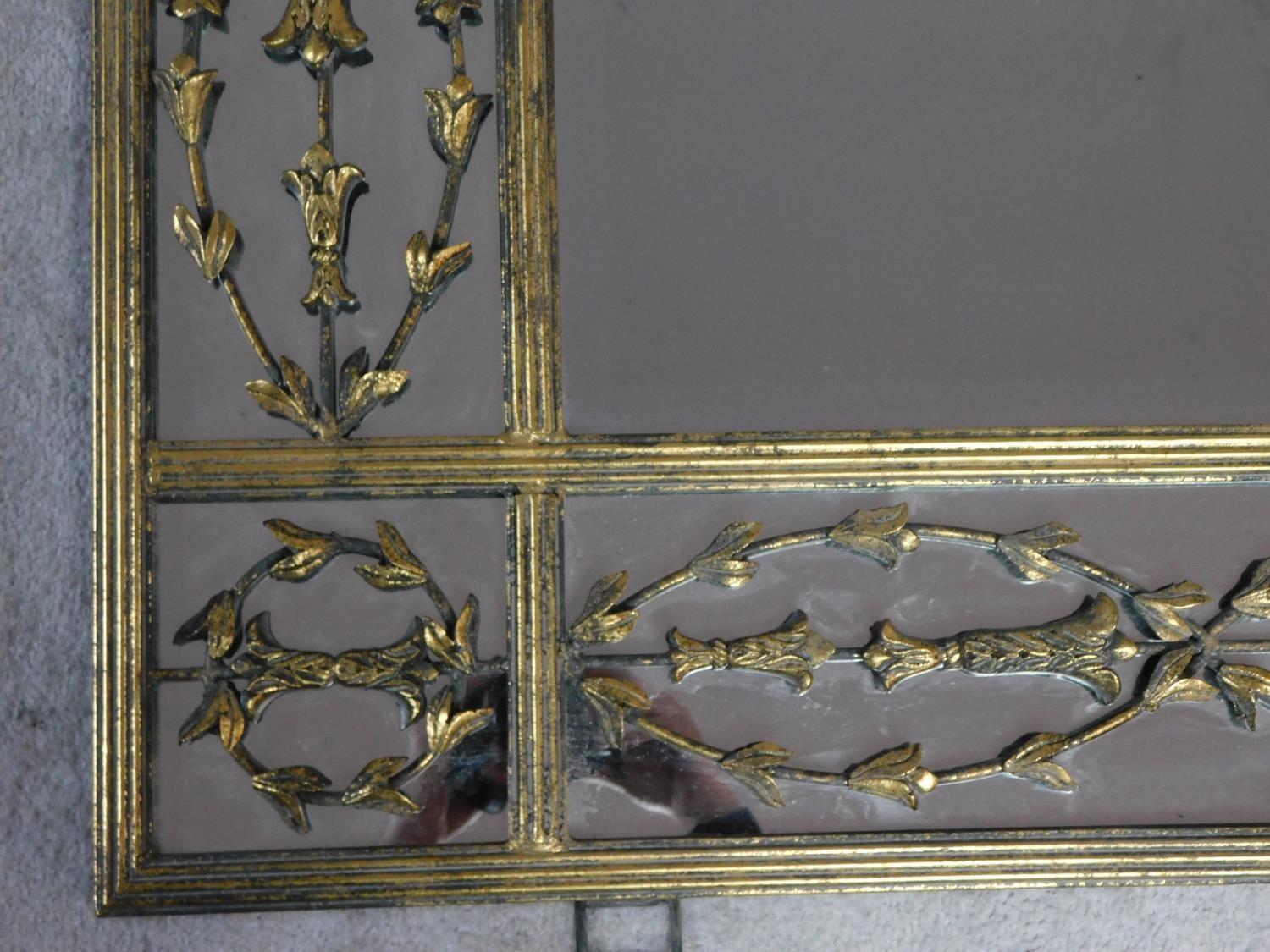 A large contemporary gilt metal overmantle or wall mirror the central rectangular plate surrounded - Image 2 of 4