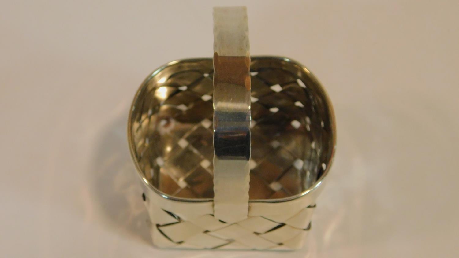 A Cartier silver basket of oval woven form with a scalloped edged handle, end marked to the side - Image 5 of 6