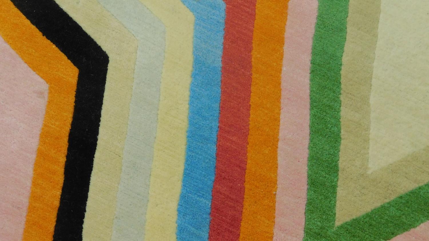 Paul Smith; handmade for the Rug Company, a carpet with large multi-coloured central star motif on - Image 3 of 4