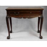 A 19th century mahogany side table in the Irish Georgian style with frieze drawer above carved