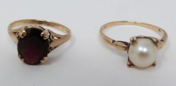 Two 9ct yellow gold dress rings. One set with a garnet with an approximate weight of 2.57 carats,