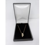 A 9 ct yellow gold belcher chain and 18 ct white and yellow gold diamond set abstract design