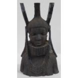 A Nigerian Benin carved wooden bust of a female warrior with neck rings and tribal headress. H.36cm