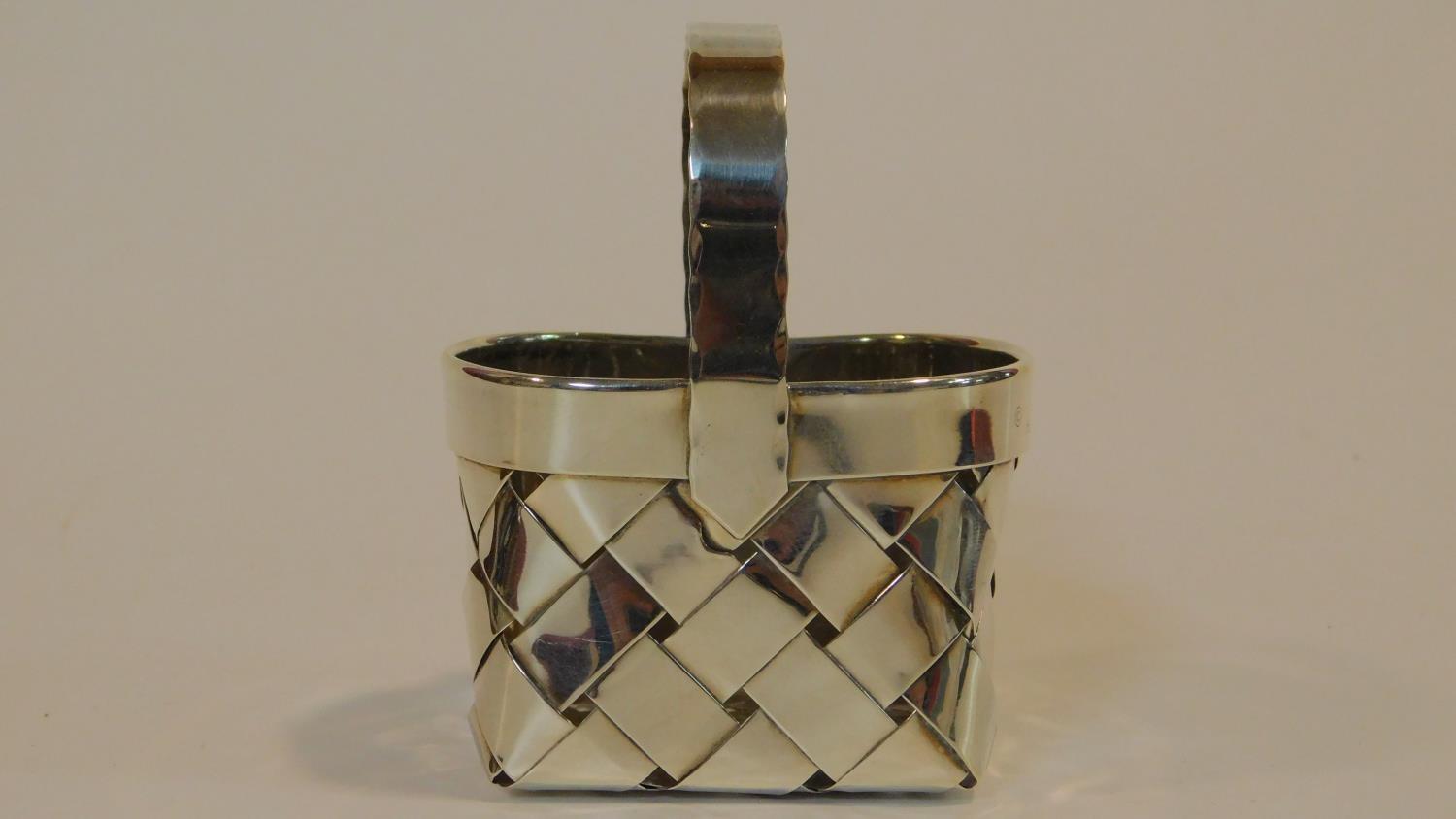 A Cartier silver basket of oval woven form with a scalloped edged handle, end marked to the side - Image 2 of 6