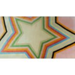 Paul Smith; handmade for the Rug Company, a carpet with large multi-coloured central star motif on