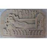 A carved sandstone Southeast Asian frieze of a reclining figure of Vishnu on serpent Anata