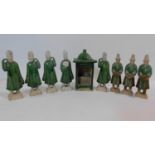 A set of Chinese Ming dynasty style earthenware attendants, together with a green glazed