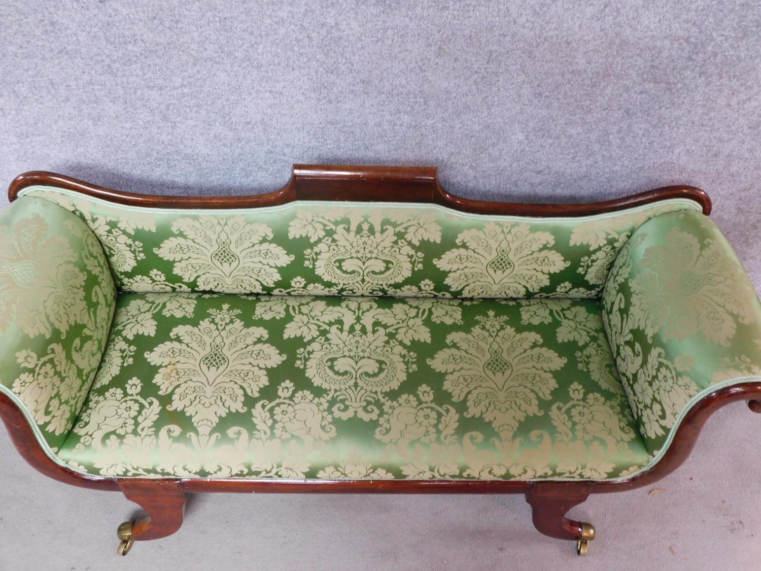 A small Regency mahogany framed scroll arm sofa in newly upholstered emerald floral damask raised on - Image 2 of 5