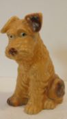 A vintage Sylvac ceramic glazed terrier dog. Stamped Sylvac, made in England. H.28cm