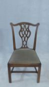 A Georgian mahogany Chippendale style dining chair with pierced splat above drop in seat on square