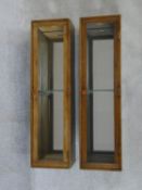 A pair of vintage oak mirror backed wall cabinets. H.94xW.26xL.22cm
