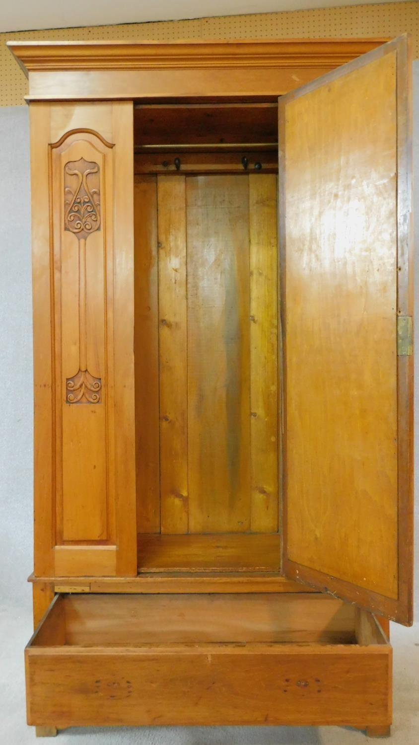 A late 19th century satin walnut wardrobe with central shaped bevelled mirror door flanked by Art - Image 3 of 9