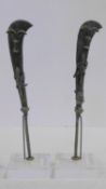 A pair of miniature Ahanti bronze swords with sculpted fish and scorpion motifs. Mounted on