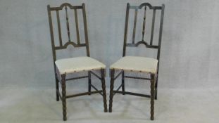 A pair of late 19th century stained beech bedroom chairs on stretchered bobbin turned supports. H.