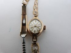 A vintage ladies gold cased Avia, 17 Jewels, Incabloc, Swiss made cocktail watch with articulated