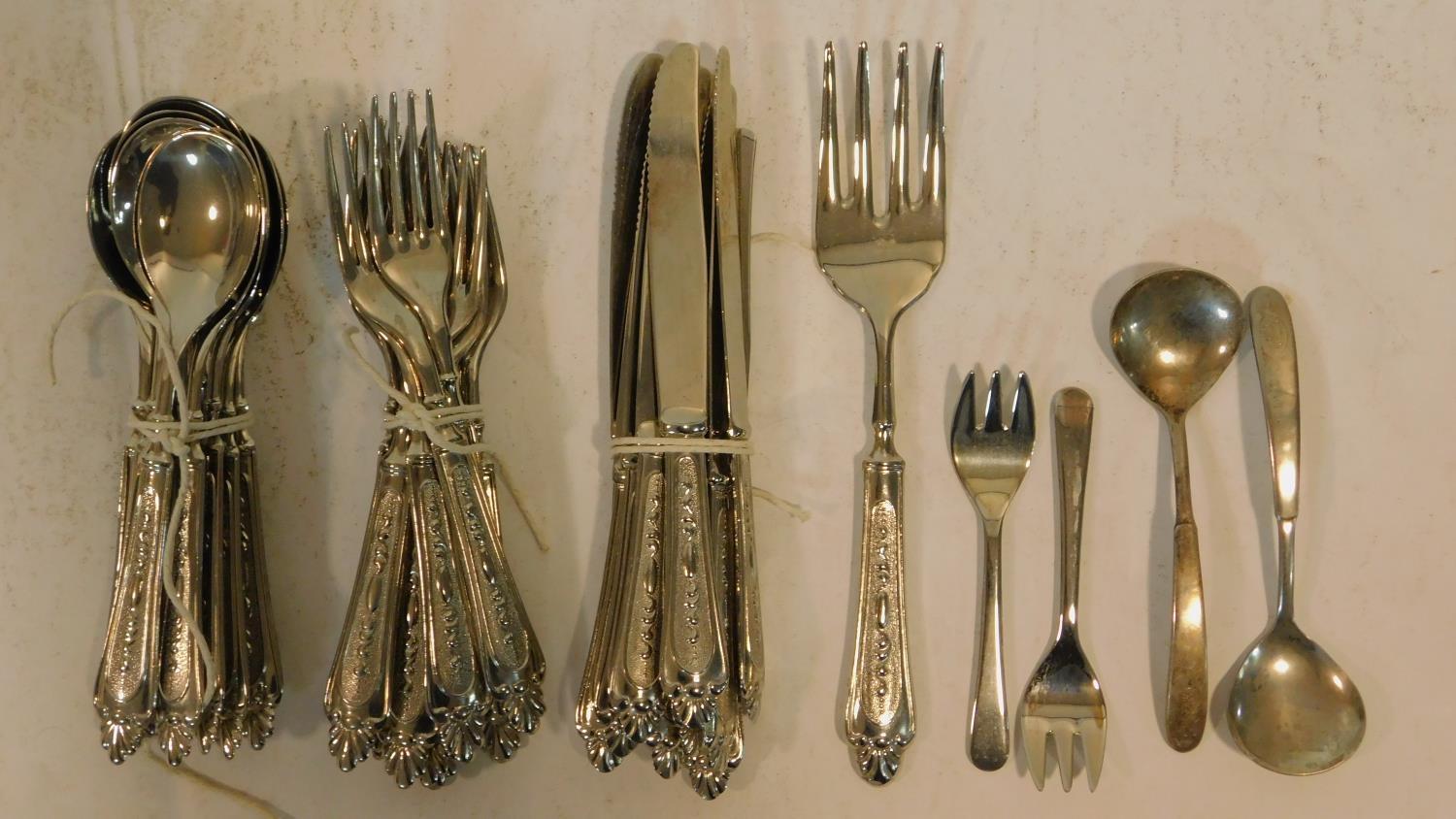 A Epzing repousse design silver plated Italian cutlery set and other silver plated cutlery.